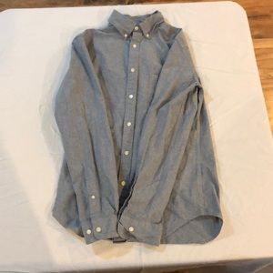 A blue buttoned downed collared shirt